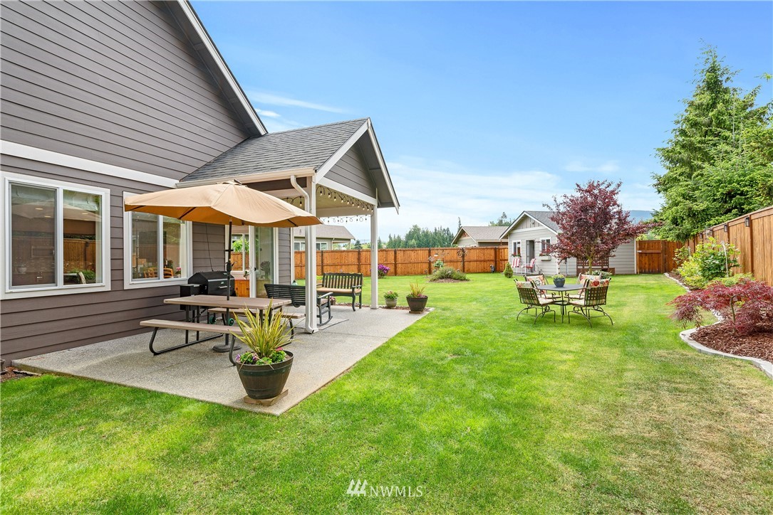 320 Blue Glacier Loop Sequim, WA 98382 - Photo 31 of 38 a view of a backyard with sitting area