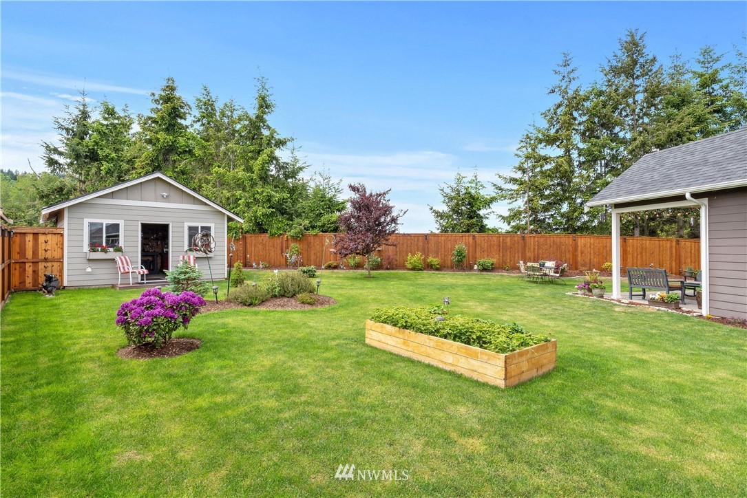 320 Blue Glacier Loop Sequim, WA 98382 - Photo 33 of 38 a front view of a house with yard