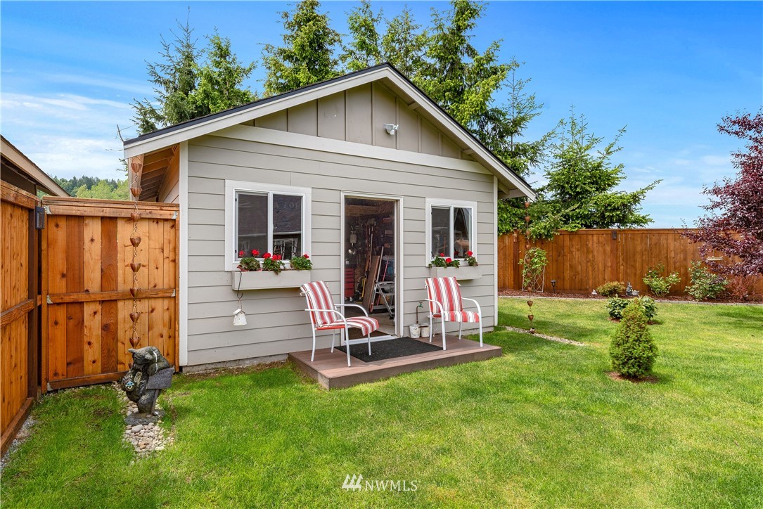 320 Blue Glacier Loop Sequim, WA 98382 - Photo 34 of 38 a view of a backyard with a slide