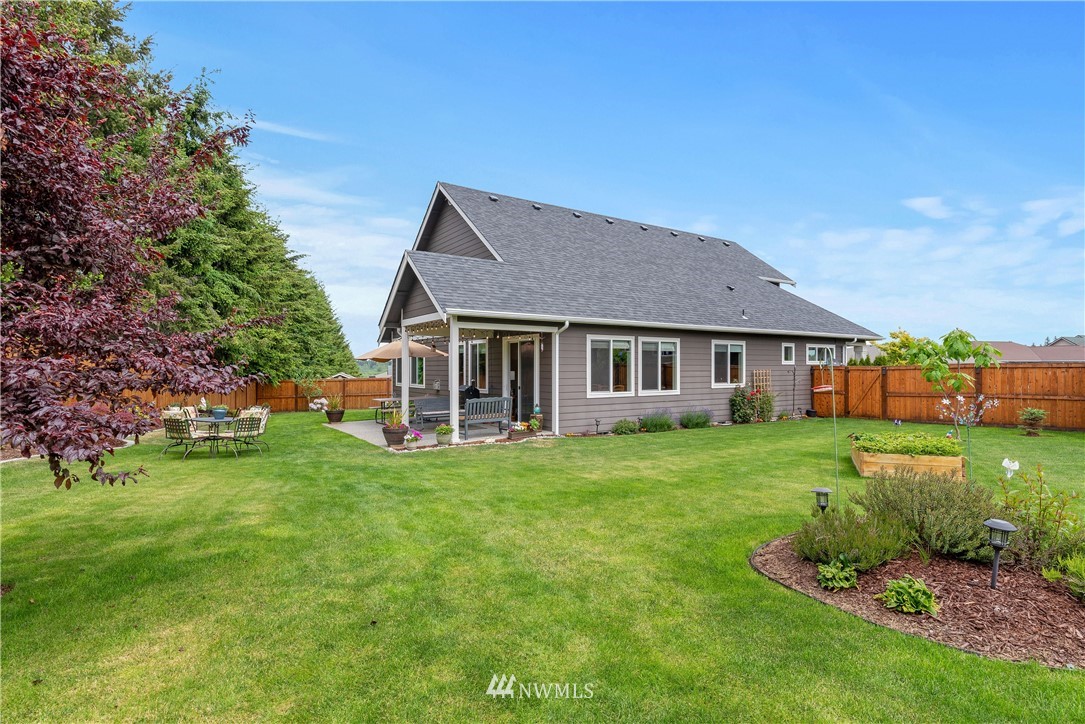 320 Blue Glacier Loop Sequim, WA 98382 - Photo 36 of 38 a front view of a house with a garden