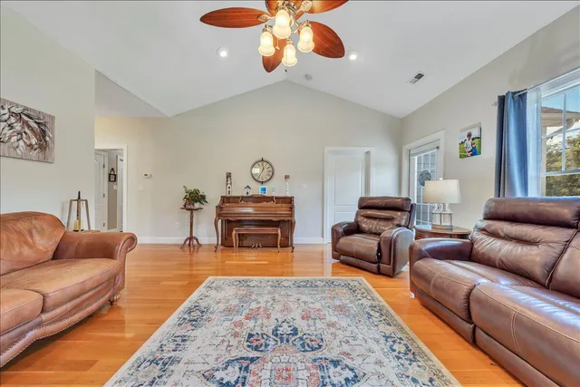 a spacious bathroom with a granite countertop sink and a mirror