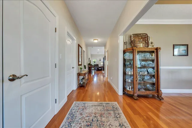 a kitchen with granite countertop wooden floors and cabinets