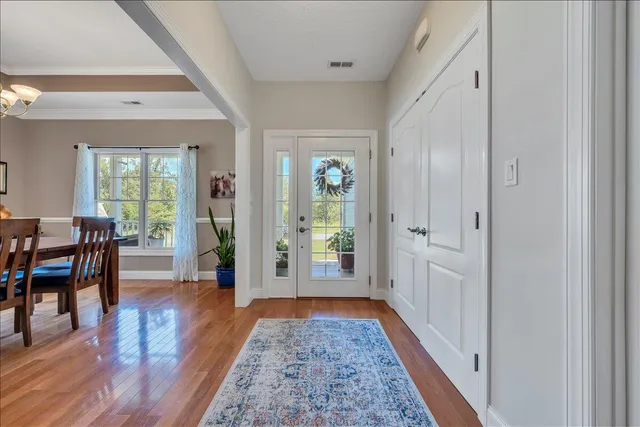 a kitchen with granite countertop a stove top oven microwave and cabinets