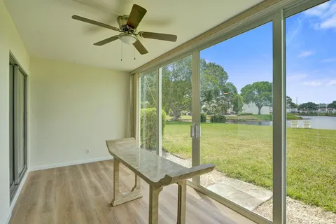 a view of a room with a table and chairs