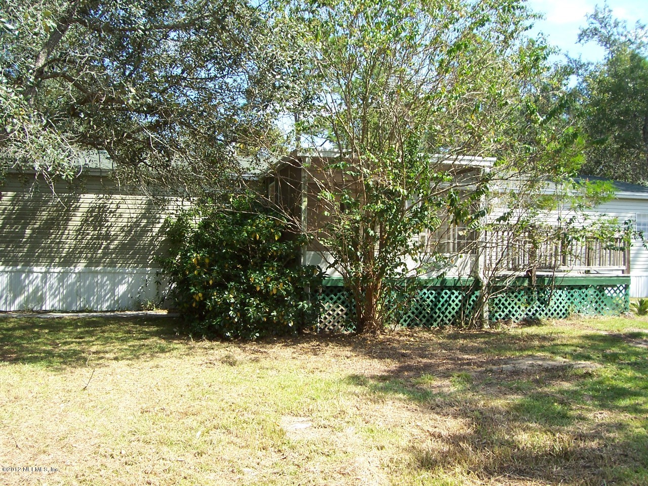 5671 Chugah Street Keystone Heights, FL 32656 - Photo 4 of 21 a view of a yard with a tree