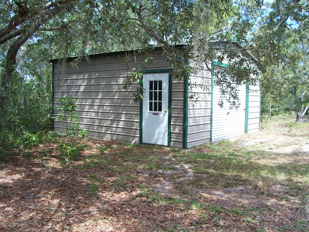 5671 Chugah Street Keystone Heights, FL 32656 - Photo 7 of 21 a view of a house with a yard