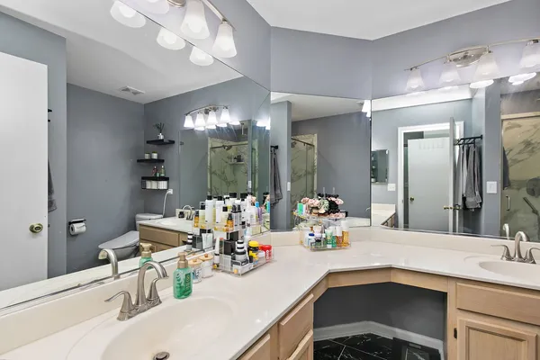 a bathroom with a sink double vanity and a mirror