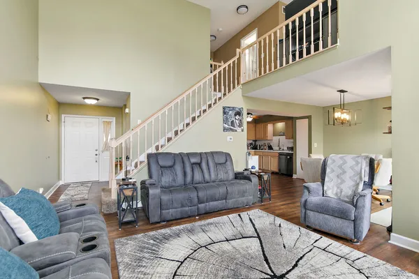 a living room with furniture or stairs and a couch