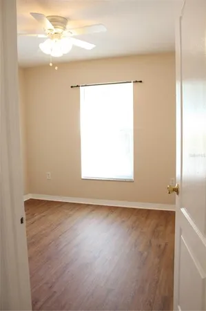 a view of an empty room with a window