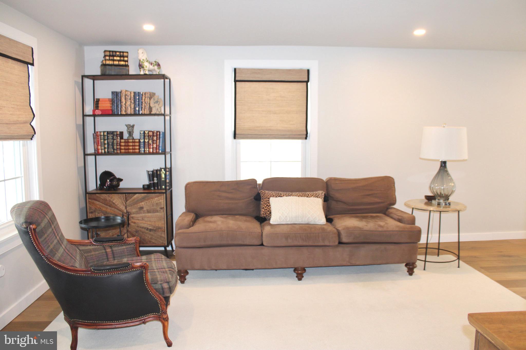 37 Cherry Lane Doylestown, PA 18901 - Photo 18 of 75 a living room with a couch and a bookshelf