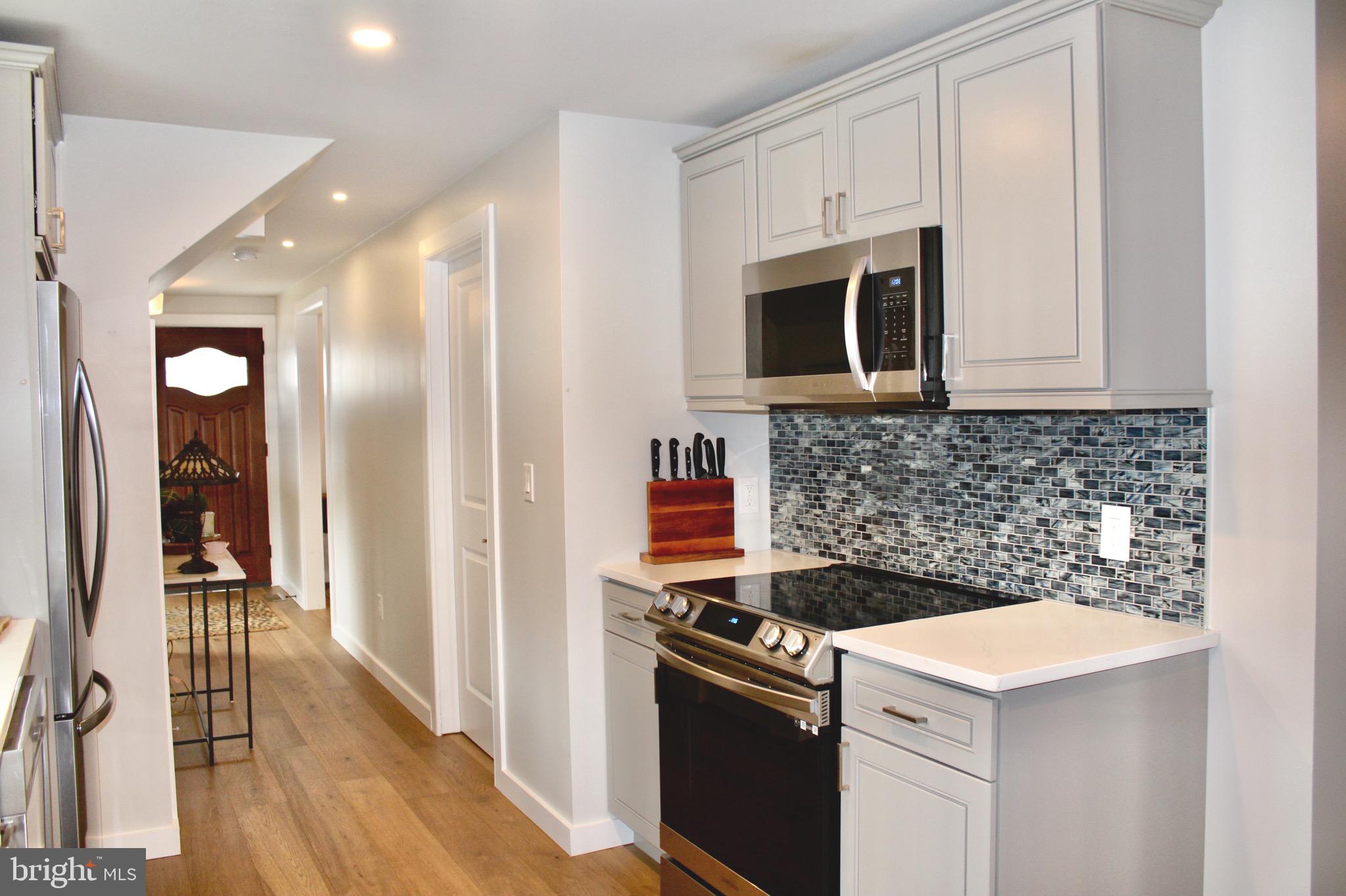 37 Cherry Lane Doylestown, PA 18901 - Photo 26 of 75 a kitchen with a stove and a microwave