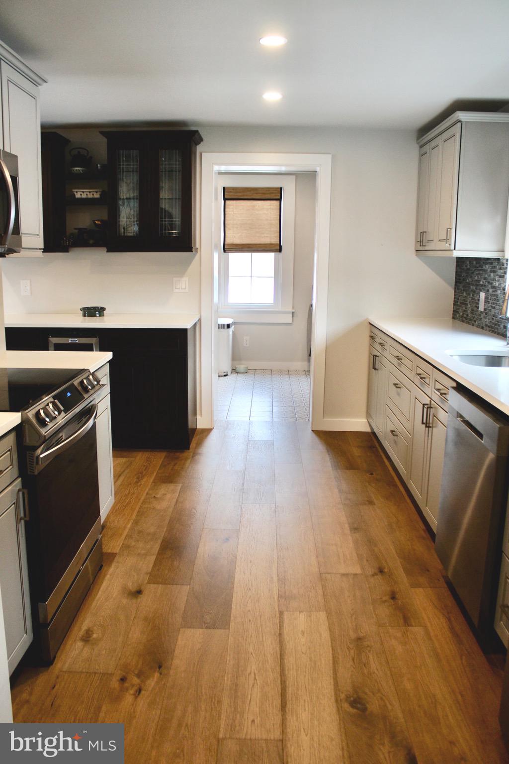 37 Cherry Lane Doylestown, PA 18901 - Photo 27 of 75 a kitchen with stainless steel appliances granite countertop a stove a sink and a refrigerator