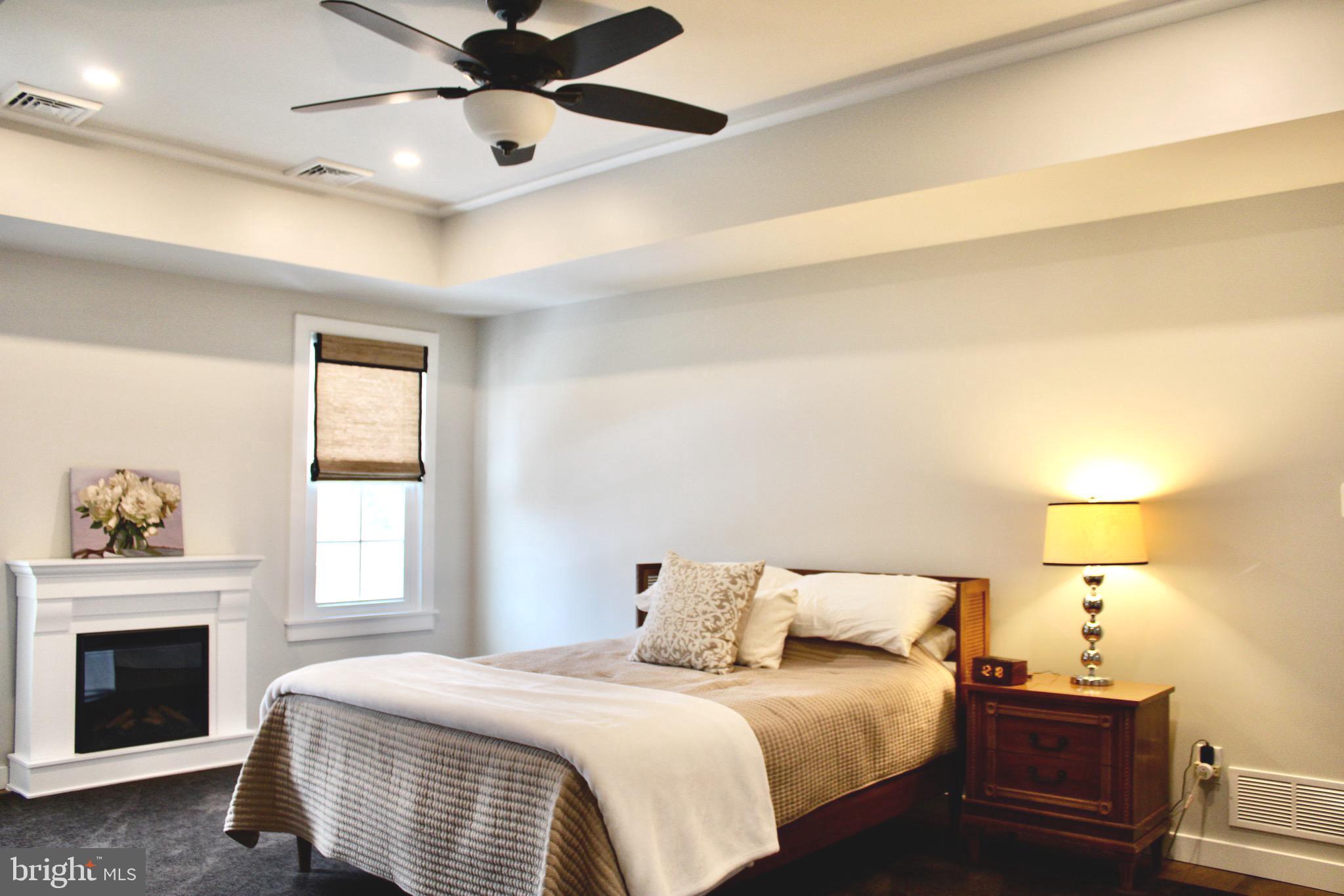 37 Cherry Lane Doylestown, PA 18901 - Photo 48 of 75 a bedroom with a bed and a chandelier