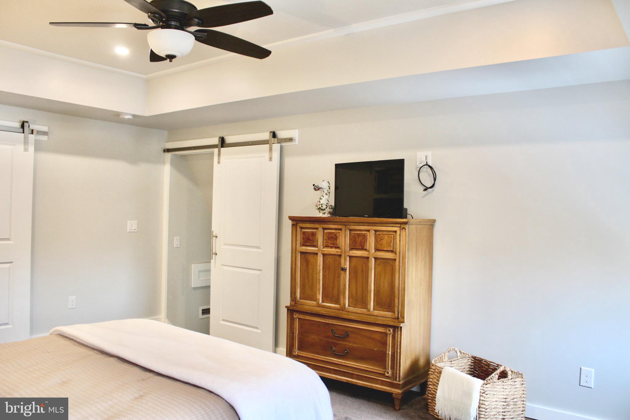 37 Cherry Lane Doylestown, PA 18901 - Photo 50 of 75 a bedroom with a bed and a flat tv screen