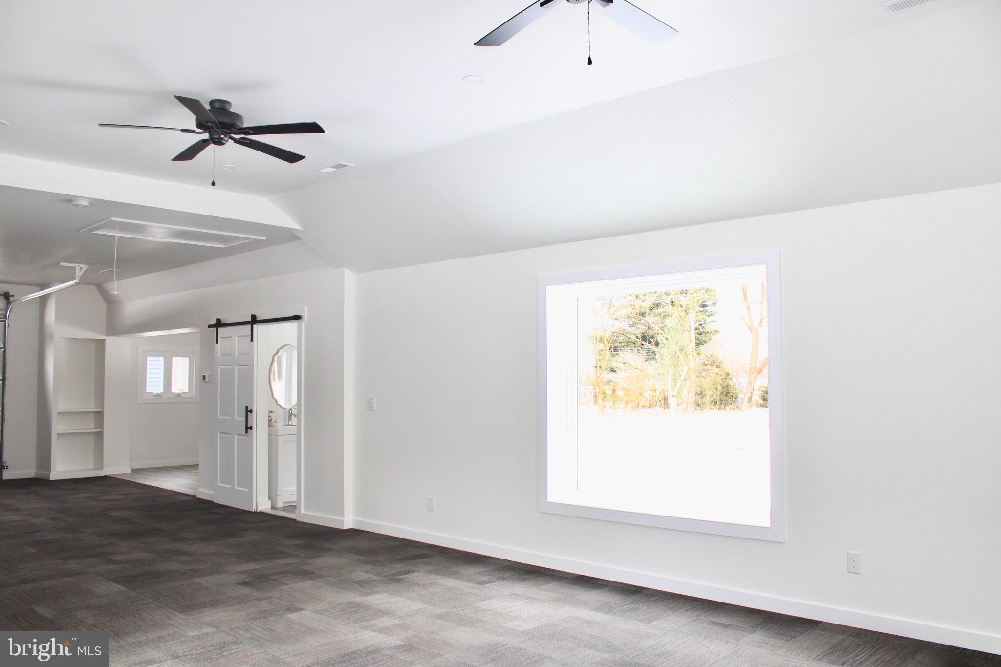 37 Cherry Lane Doylestown, PA 18901 - Photo 64 of 75 an empty room with a window and a ceiling fan