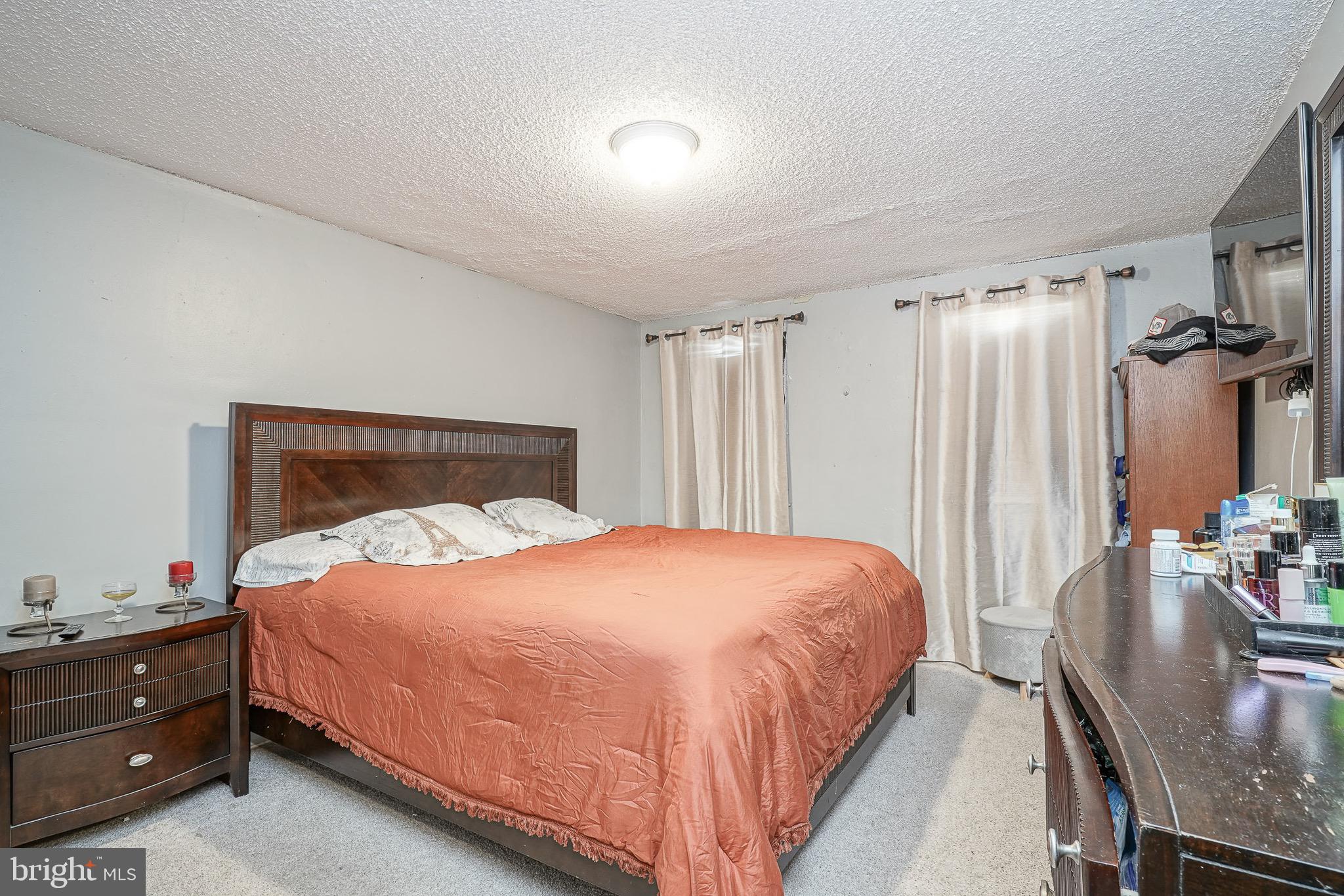 541 Randolph Street Camden, NJ 08105 - Photo 11 of 22 a bedroom with a bed and a table