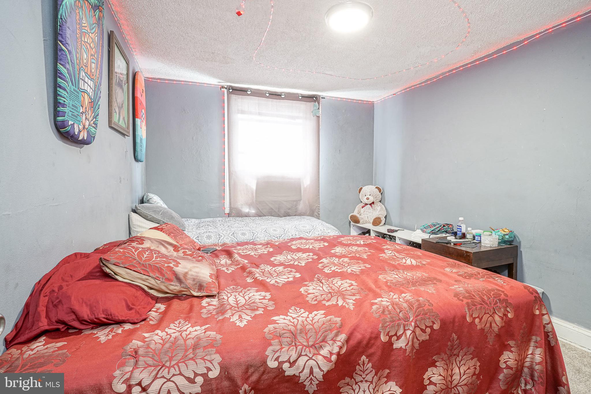 541 Randolph Street Camden, NJ 08105 - Photo 13 of 22 a bedroom with a bed and window