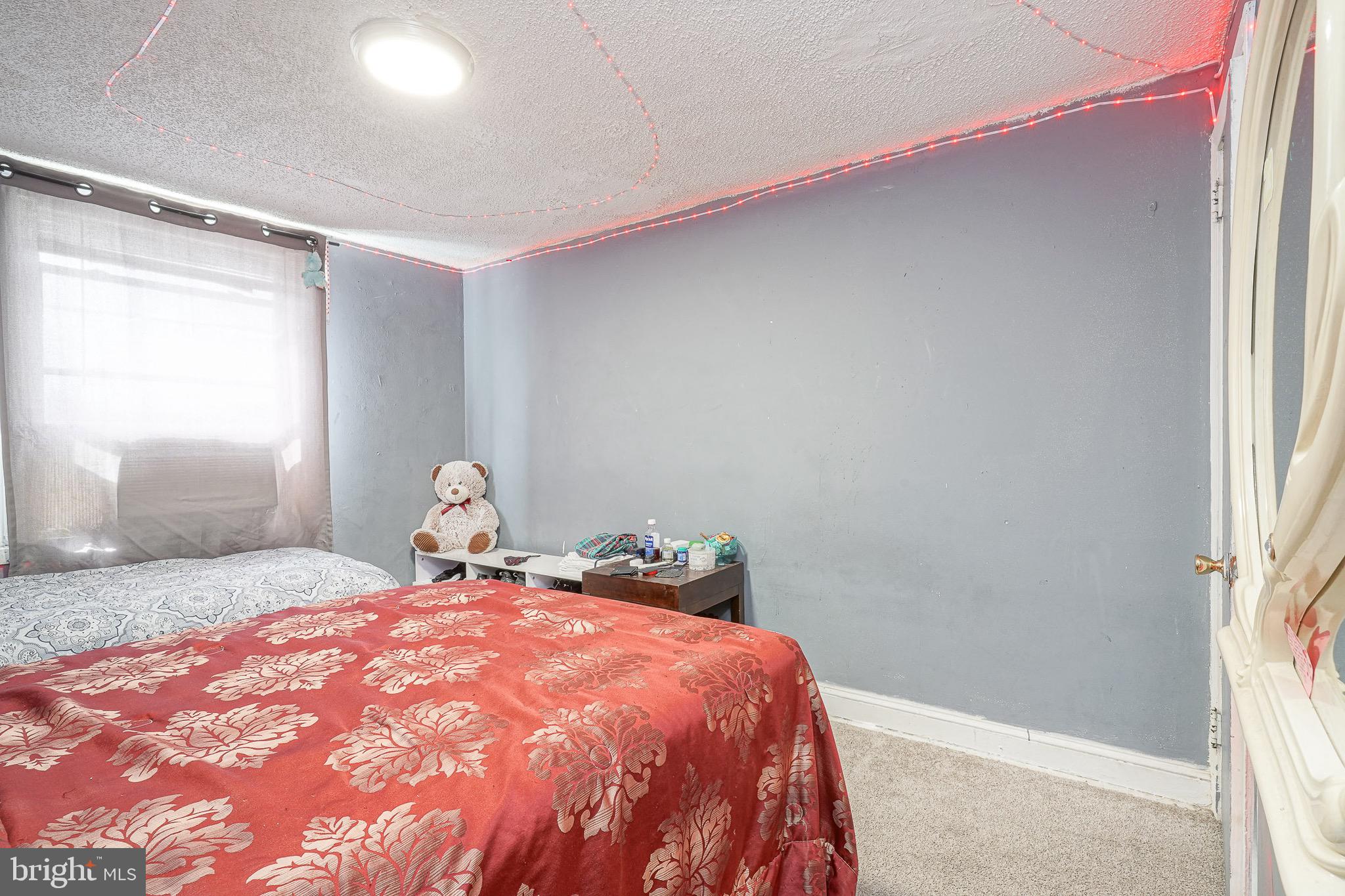 541 Randolph Street Camden, NJ 08105 - Photo 14 of 22 a bedroom with a bed and a window