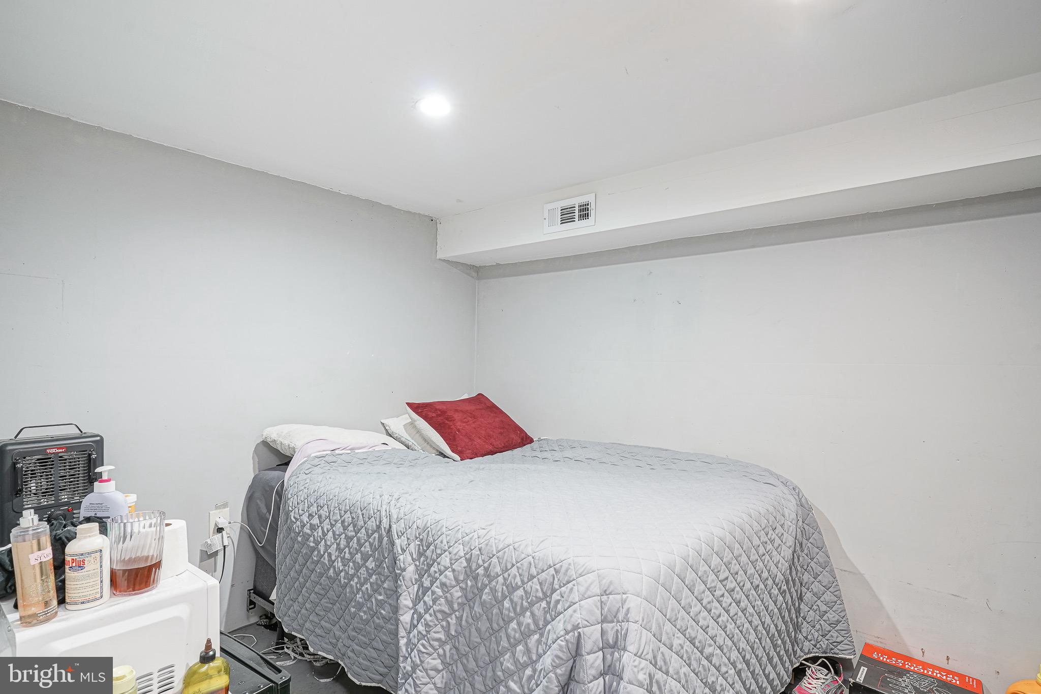 541 Randolph Street Camden, NJ 08105 - Photo 21 of 22 a bedroom with a bed and a cabinets