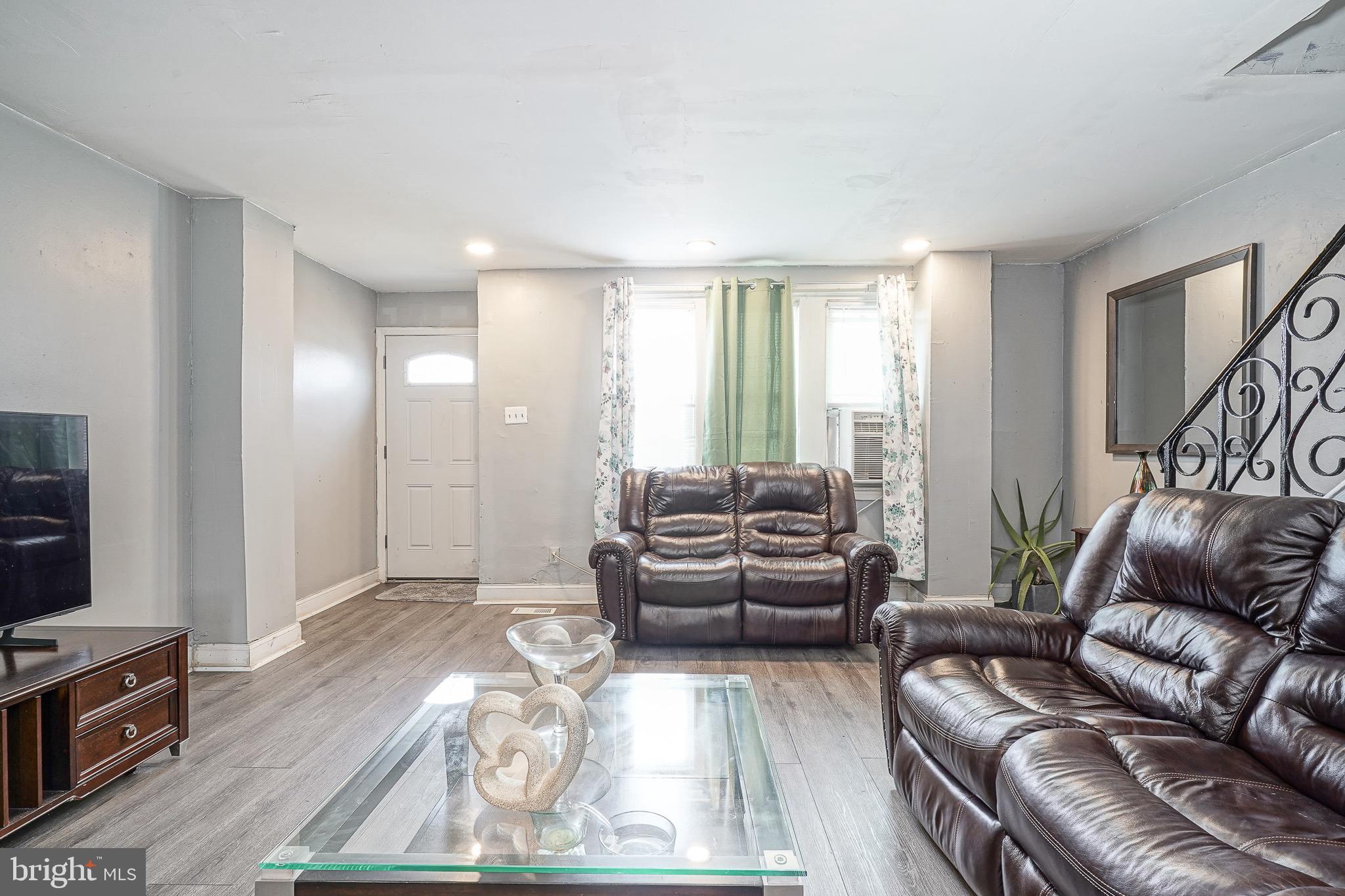 541 Randolph Street Camden, NJ 08105 - Photo 4 of 22 a living room with furniture and a flat screen tv