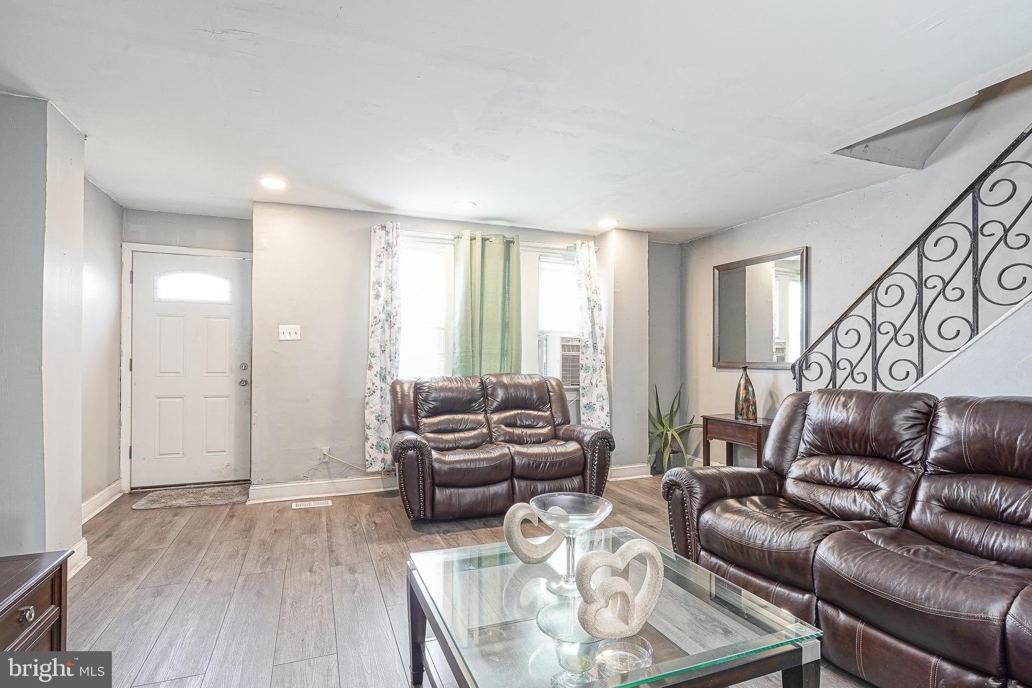 541 Randolph Street Camden, NJ 08105 - Photo 5 of 22 a living room with furniture and a large window