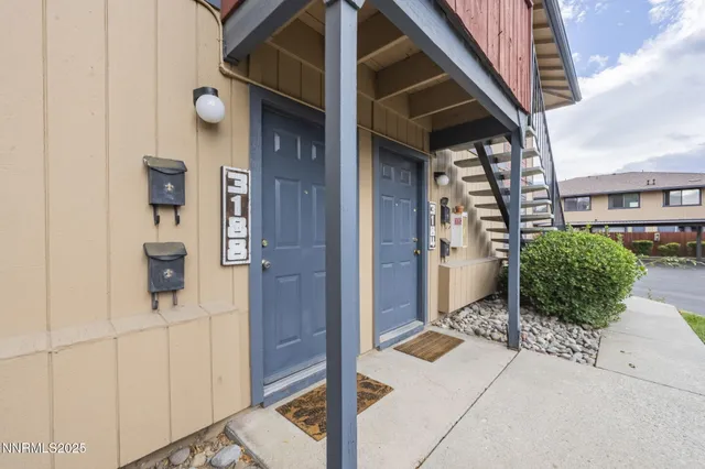 an empty room with floor to ceiling window and an outdoor view