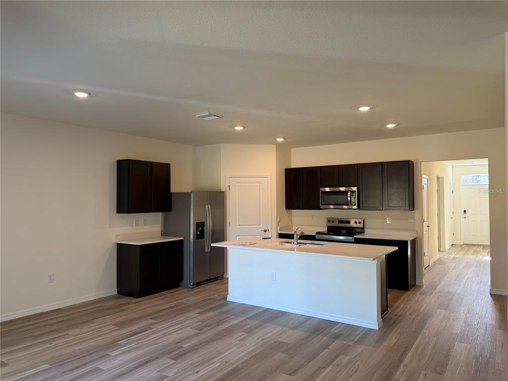 5326 Southwest 52nd Avenue Gainesville, FL 32608 - Photo 3 of 10 a large kitchen with cabinets