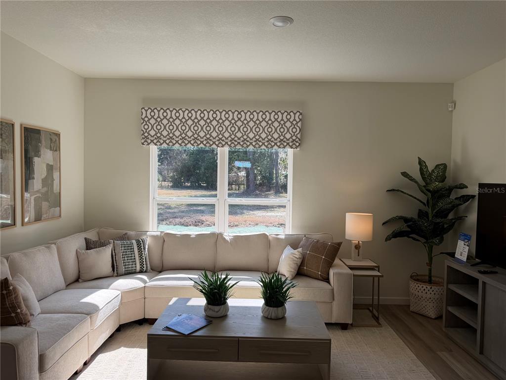 5326 Southwest 52nd Avenue Gainesville, FL 32608 - Photo 5 of 10 a living room with furniture and a large window