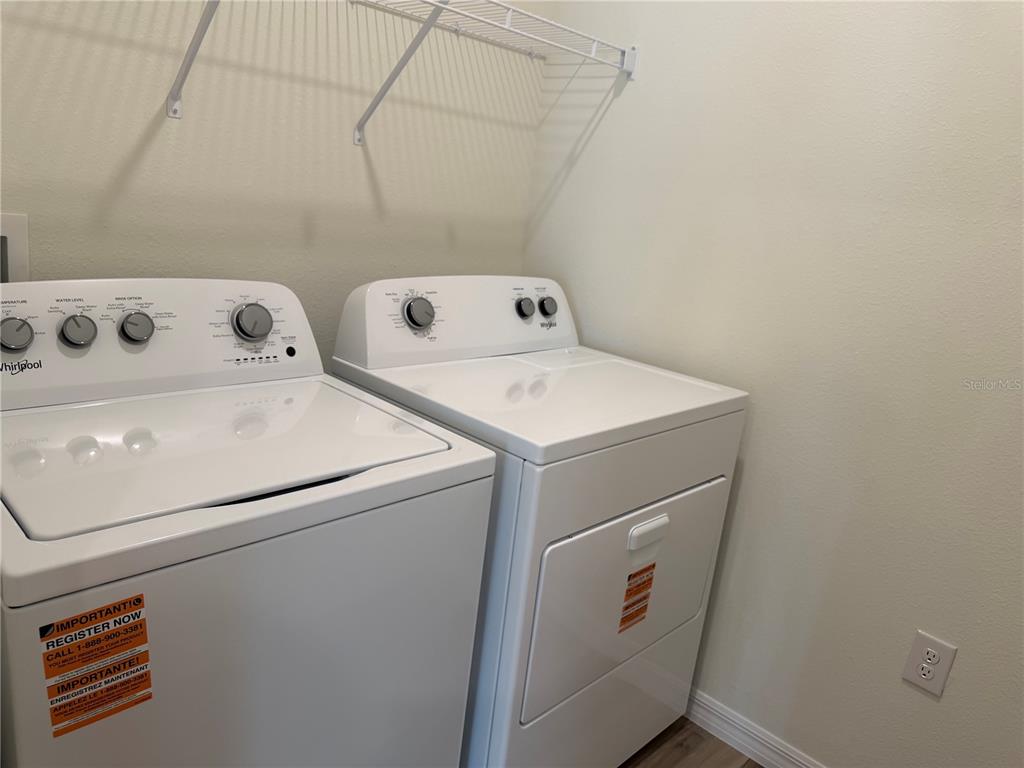 5326 Southwest 52nd Avenue Gainesville, FL 32608 - Photo 8 of 10 a utility room with dryer and washer
