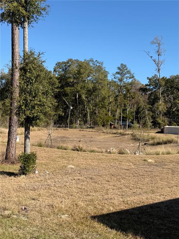 5326 Southwest 52nd Avenue Gainesville, FL 32608 - Photo 9 of 10 a view of lake with a house in the background