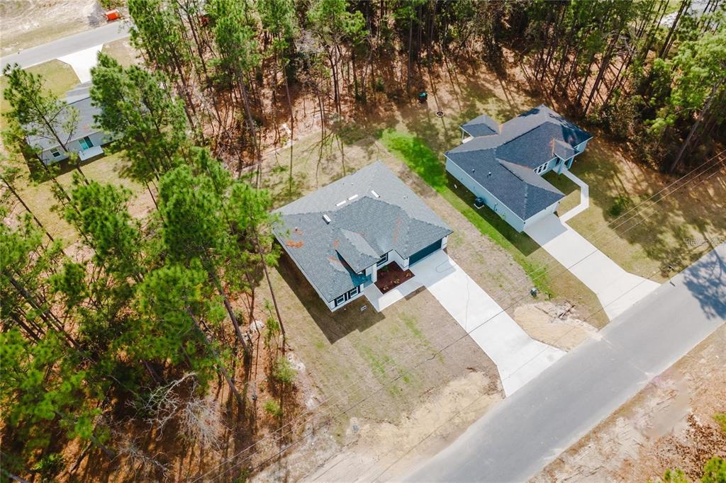 6732 Southwest 132nd Street Ocala, FL 34473 - Photo 35 of 36 an aerial view of a house with trees