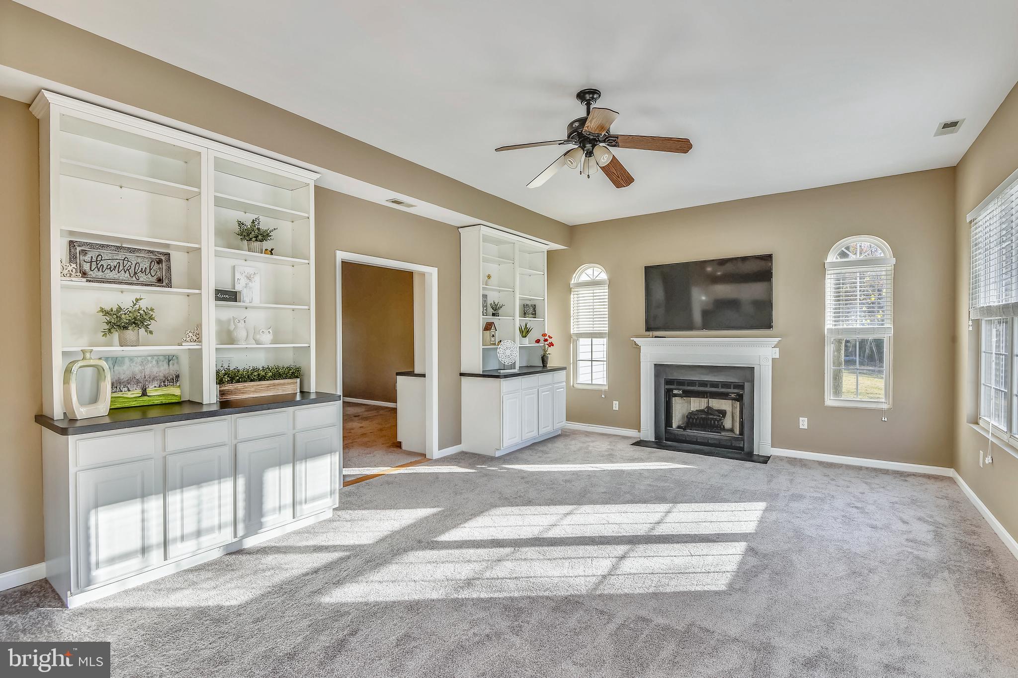 3946 Cove Road Edgewater, MD 21037 - Photo 14 of 52 FAMILY ROOM WITH GAS FIREPLACE AND BUILT-INS