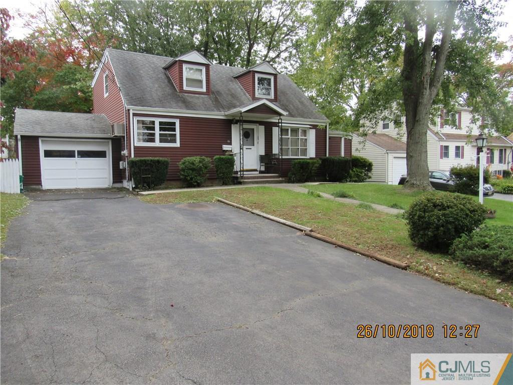 21 Halstead Road New Brunswick, NJ 08901 - Photo 2 of 22 a front view of a house with a yard and garage