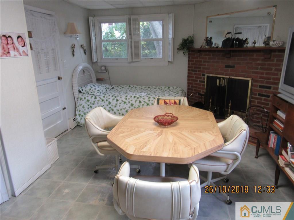 21 Halstead Road New Brunswick, NJ 08901 - Photo 11 of 22 a living room with furniture and a fireplace