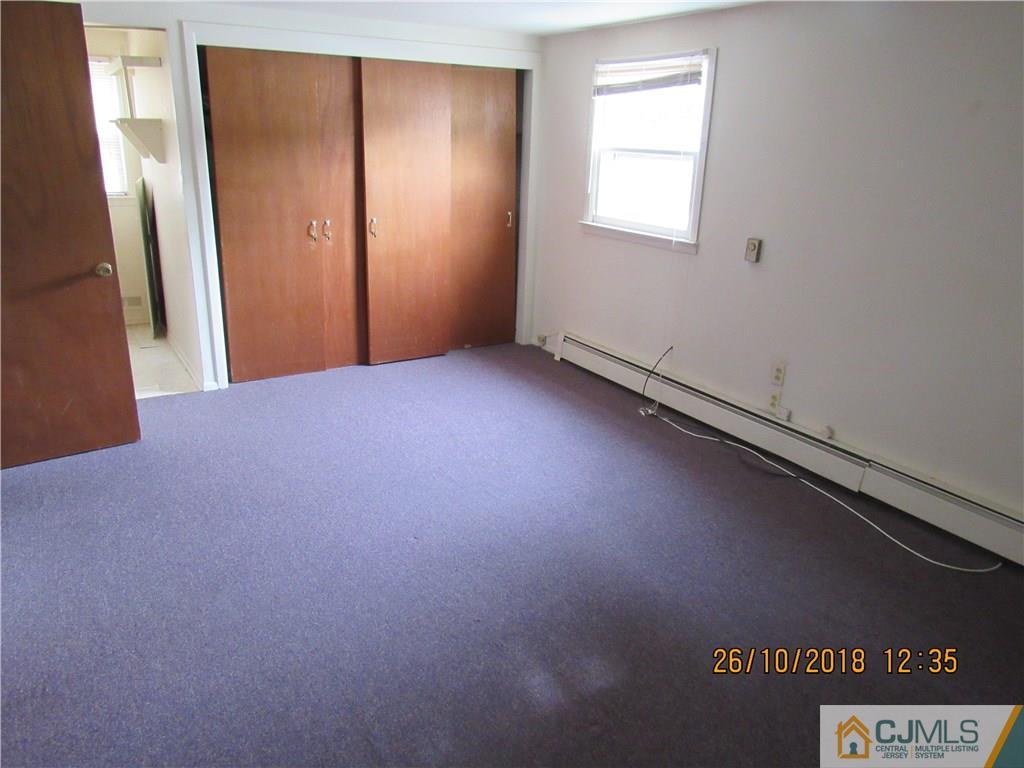 21 Halstead Road New Brunswick, NJ 08901 - Photo 17 of 22 an empty room with a window