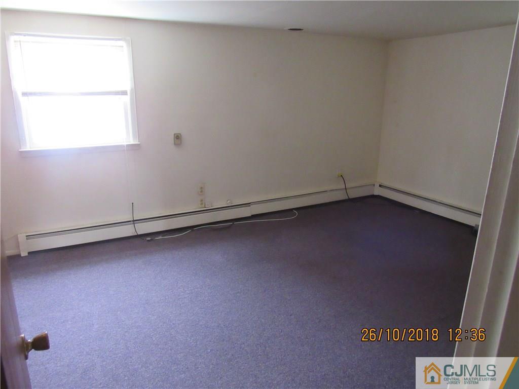21 Halstead Road New Brunswick, NJ 08901 - Photo 18 of 22 an empty room with a window