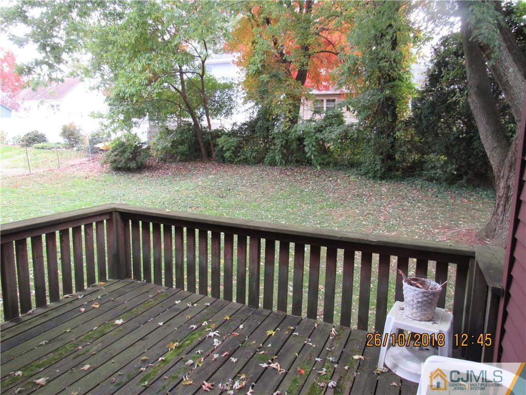 21 Halstead Road New Brunswick, NJ 08901 - Photo 22 of 22 a balcony with wooden floor and fence