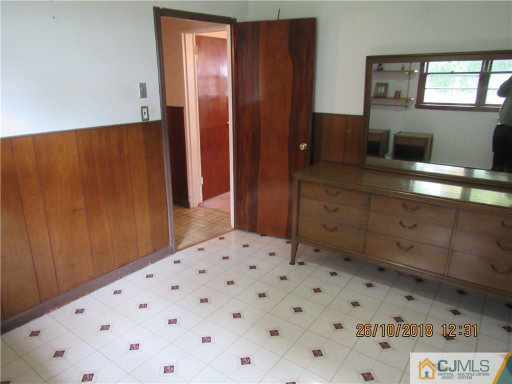 21 Halstead Road New Brunswick, NJ 08901 - Photo 6 of 22 a bathroom with a sink and mirror