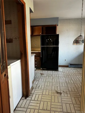 a kitchen with stainless steel appliances a stove a sink and a microwave