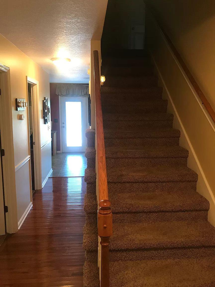 1701 Carter Road Decherd, TN 37324 - Photo 12 of 25 Don't miss the gorgeous hardwood floor. Now lets head upstairs and take a look.