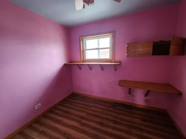 a view of a room with pool table and a window