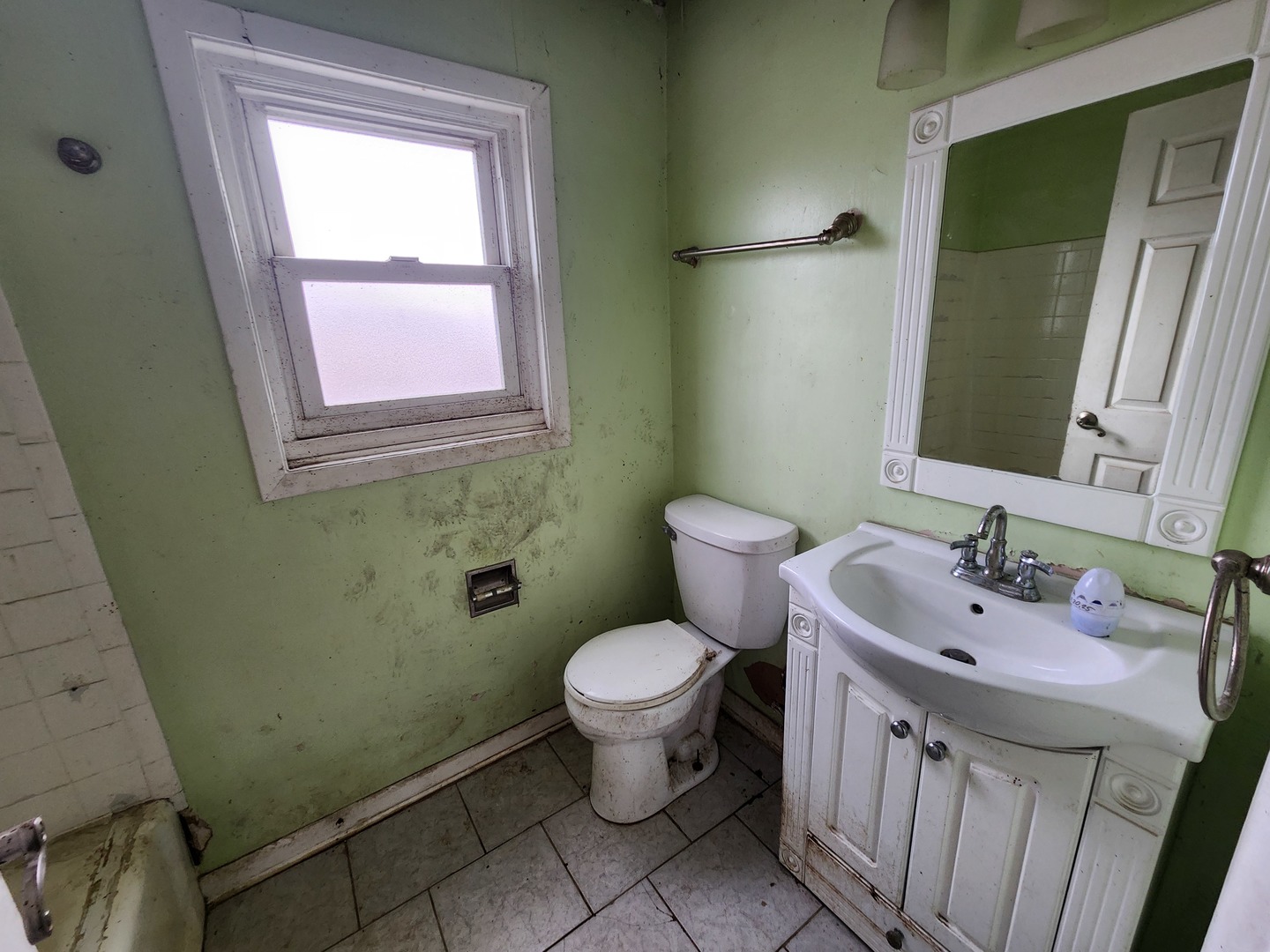 2211 171st Street Hazel Crest, IL 60429 - Photo 9 of 12 a bathroom with a sink toilet and a mirror