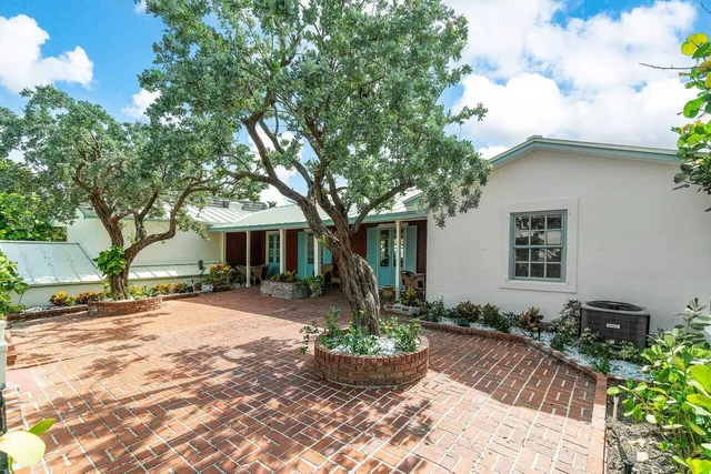 a front view of a house with a patio