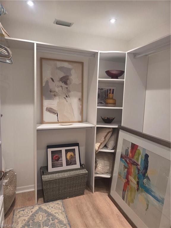 3531 County Barn Road, Unit C201 Naples, FL 34112 - Photo 17 of 20 Sitting room with wood finished floors and baseboards