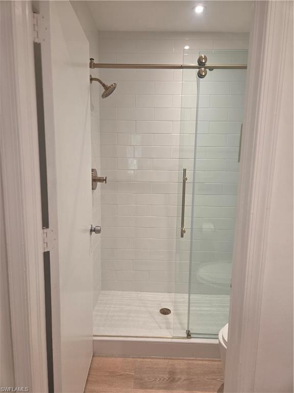 3531 County Barn Road, Unit C201 Naples, FL 34112 - Photo 19 of 20 Bathroom with a stall shower and light wood finished floors