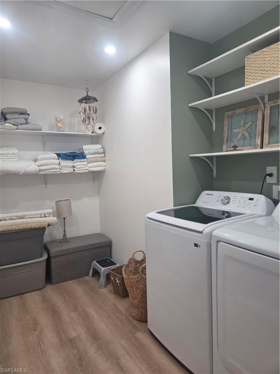 3531 County Barn Road, Unit C201 Naples, FL 34112 - Photo 20 of 20 Washroom with wood finished floors, washing machine and dryer, and recessed lighting
