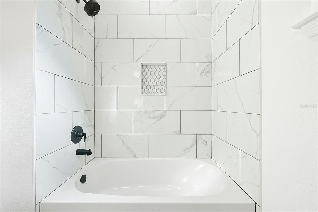 115 Leon Street Altamonte Springs, FL 32701 - Photo 12 of 15 a bathroom with a bathtub