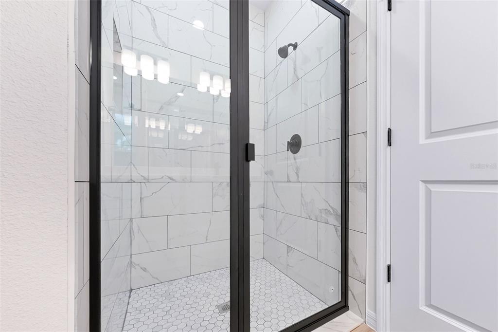 115 Leon Street Altamonte Springs, FL 32701 - Photo 14 of 15 a bathroom with a glass shower door