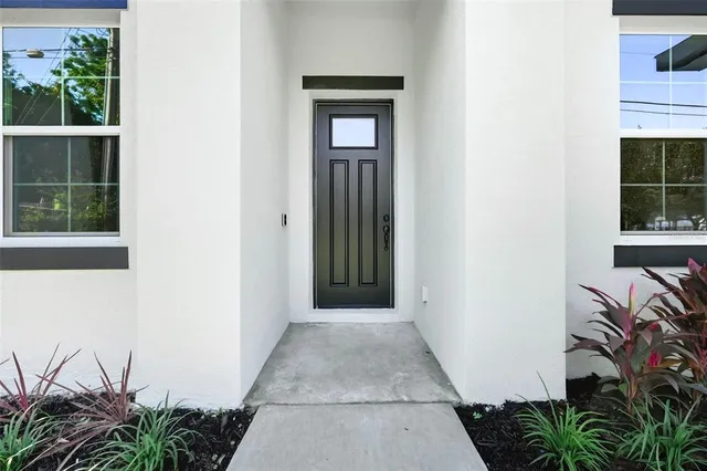 a view of a house with a small yard