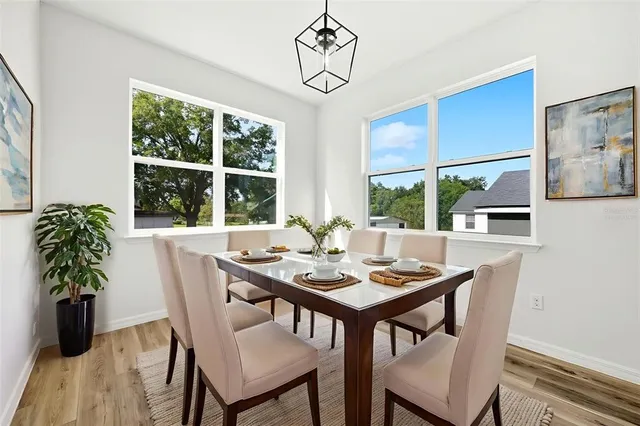 a view of a dining room with furniture window and outside view